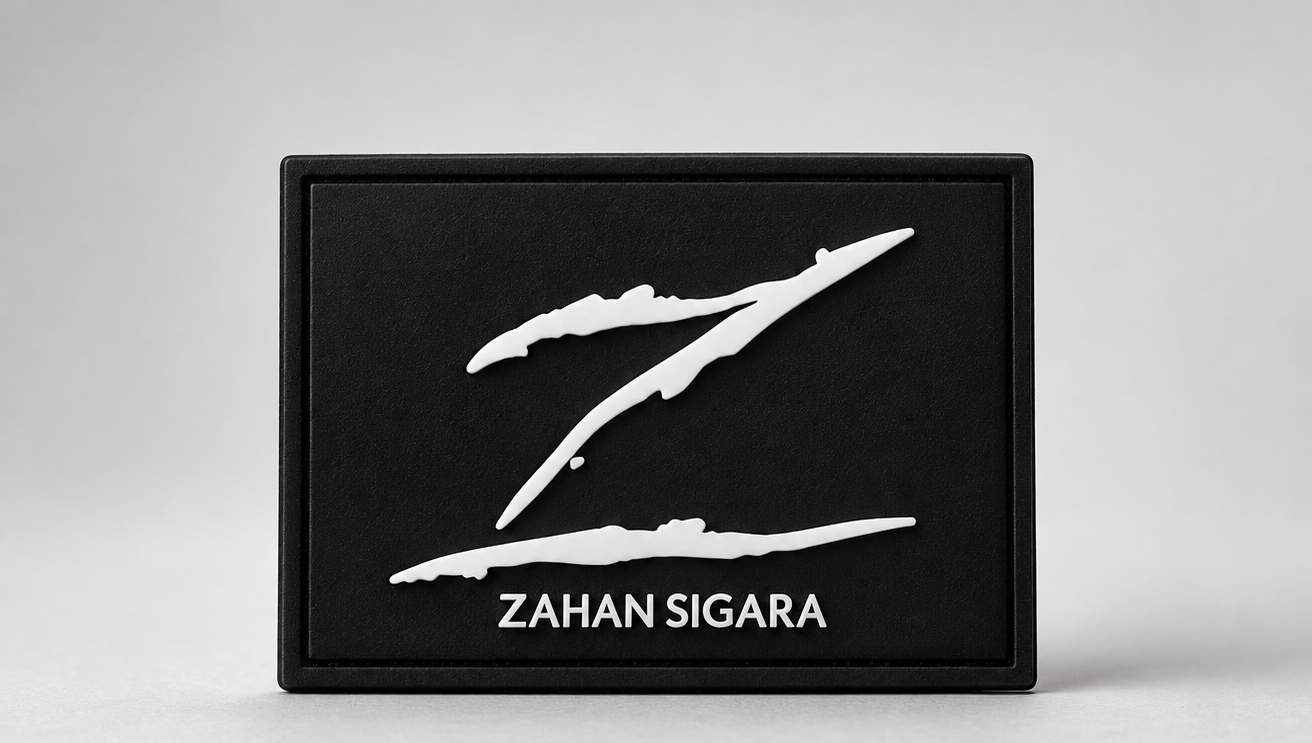 Black rubber patch with white Z logo and Zahan Sigara wordmark